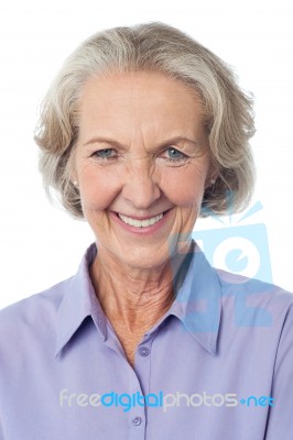 Portrai Of A Smiling Aged Lady Stock Photo