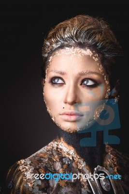 Portrait A Girl With Golden Icon Painting Makeup Stock Photo