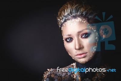 Portrait A Girl With Golden Icon Painting Makeup Stock Photo