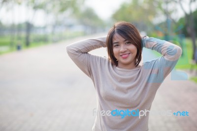 Portrait Asian Woman In A Park Stock Photo