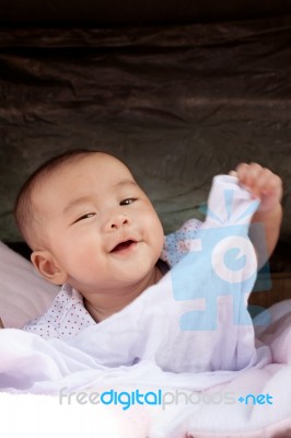 Portrait Close Up Face Of Asian Baby Lying On Bed And Playing Wi… Stock Photo