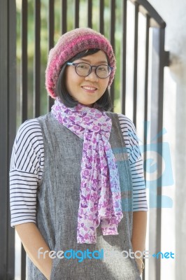 Portrait Of 40s Years Asian Woman Wearing Wool Hood And Silk Scarf Toothy Smiling With Happiness Emotion Stock Photo