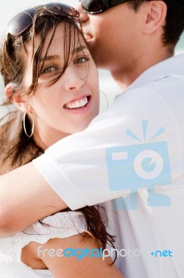 Portrait Of A Beautiful Couple Hugging Stock Photo