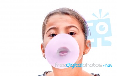 Portrait Of A Beautiful Little Girl Blowing Bubbles Stock Photo
