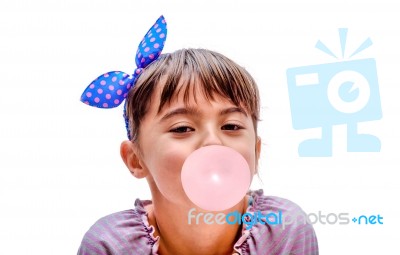 Portrait Of A Beautiful Little Girl Blowing Bubbles Stock Photo