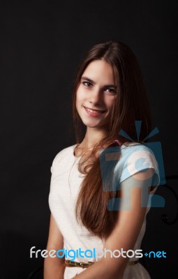 Portrait Of A Beautiful Young Smiling Girl In A Bright Dress Stock Photo