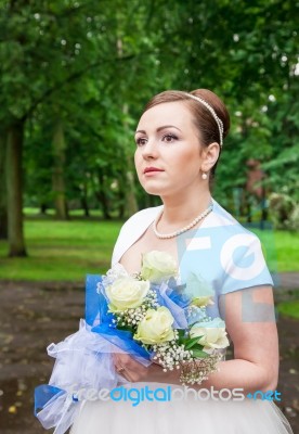 Portrait Of A Bride With A Bouquet Of Flowers Stock Photo