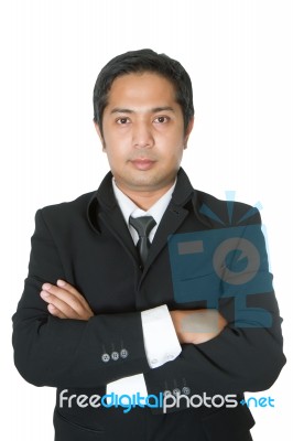 Portrait Of A Confident Businessman With Folded Arms Stock Photo