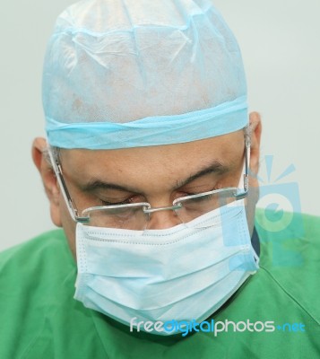 Portrait Of A Doctor During The Surgery Stock Photo