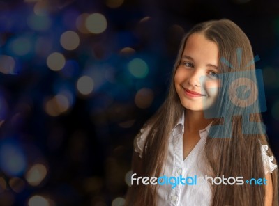 Portrait Of A Little Girl With Long Hair Stock Photo