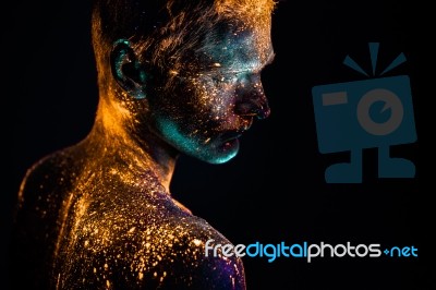 Portrait Of A Man Painted In Fluorescent Uv Colors Stock Photo