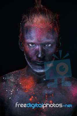 Portrait Of A Man Painted In Fluorescent Uv Colors Stock Photo