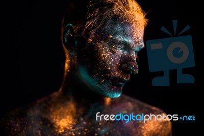 Portrait Of A Man Painted In Fluorescent Uv Colors Stock Photo