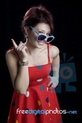 Portrait Of A Women In Retro Red Dress With Sunglasses Stock Photo