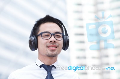 Portrait Of A Young Man Listening To Music Stock Photo