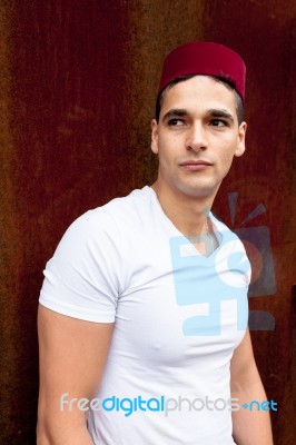 Portrait Of A Young Man With A Fez Cap Stock Photo