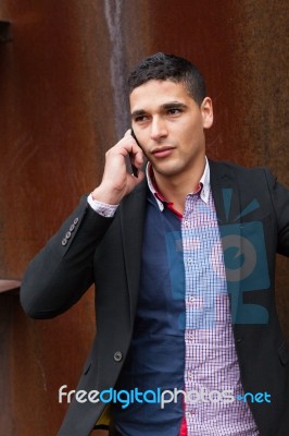 Portrait Of A Young Man With Talking On The Phone Stock Photo