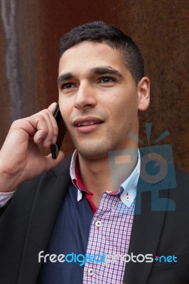 Portrait Of A Young Man With Talking On The Phone Stock Photo