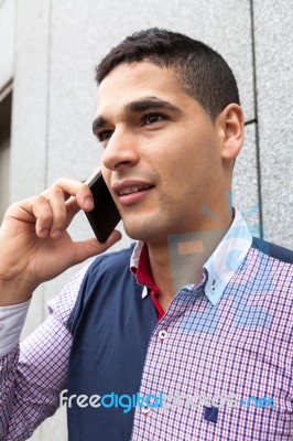 Portrait Of A Young Man With Talking On The Phone Stock Photo