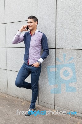 Portrait Of A Young Man With Talking On The Phone Stock Photo