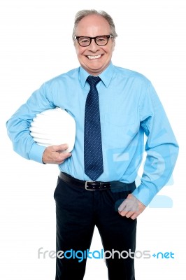 Portrait Of An Architect Holding A Safety Helmet Stock Photo