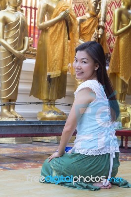 Portrait Of Asian Woman Praying Buddha Statue Stock Photo