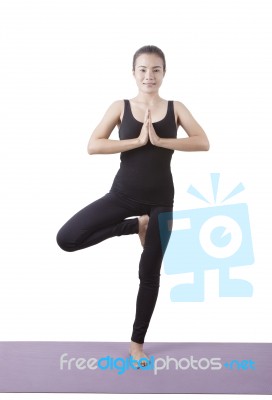 Portrait Of Asian Woman Wearing Black Body Suit Sitting In Yoga Meditation Position Isolated White Background Stock Photo