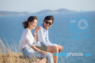 Portrait Of Asian Younger Man And Woman Relaxing Vacation At Sea Side Happiness Emotion Stock Photo