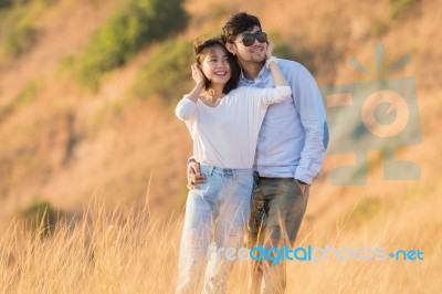 Portrait Of Asian Younger Man And Woman Relaxing Vacation At Sea Side Happiness Emotion Stock Photo