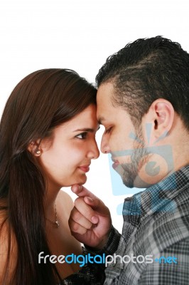 Portrait Of Attractive Hispanic Couple On White Background Stock Photo