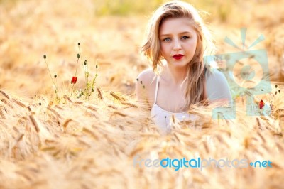 Portrait Of Beautiful Girl In Field Stock Photo