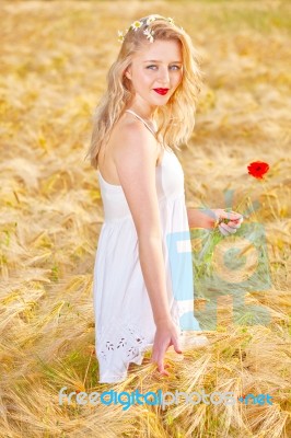 Portrait Of Beautiful Girl In Field Stock Photo