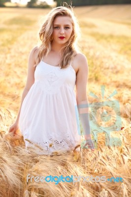 Portrait Of Beautiful Girl In Field Stock Photo