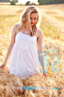 Portrait Of Beautiful Girl In Field Stock Photo