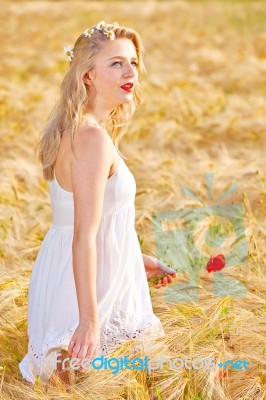 Portrait Of Beautiful Girl In Field Stock Photo