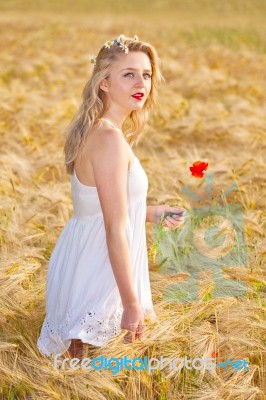 Portrait Of Beautiful Girl In Field Stock Photo