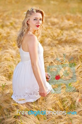 Portrait Of Beautiful Girl In Field Stock Photo