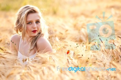 Portrait Of Beautiful Girl In Field Stock Photo