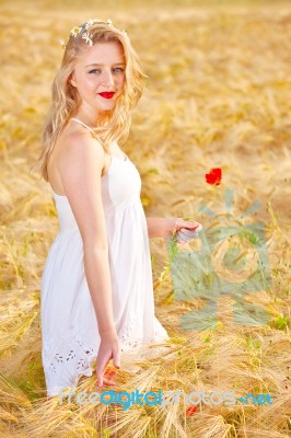 Portrait Of Beautiful Girl In Field Stock Photo