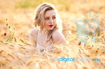 Portrait Of Beautiful Girl In Field Stock Photo