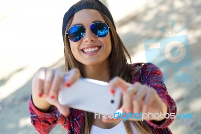 Portrait Of Beautiful Girl Taking A Selfie With Mobile Phone In Stock Photo