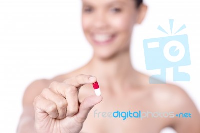 Portrait Of Beautiful Woman, Holding  Pill Stock Photo