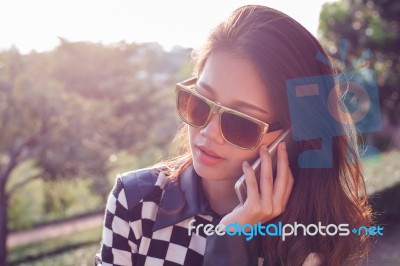 Portrait Of Beautiful Woman Listening On Mobile Phone Use For Pe… Stock Photo