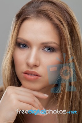 Portrait Of Beautiful Woman With Blue Eyes Stock Photo