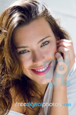 Portrait Of Beautiful Woman With Smile At Home Stock Photo