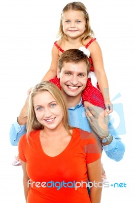 Portrait Of Cheerful Family Of Three Having Fun Stock Photo