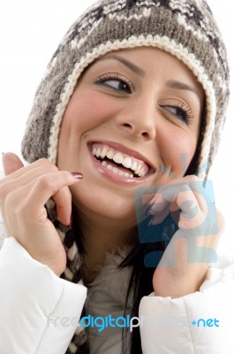 Portrait Of Cheerful Female With Woolen Cap Stock Photo