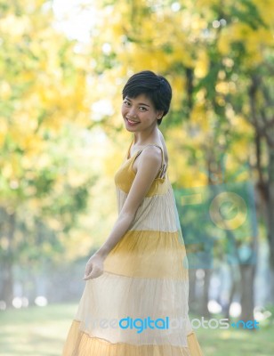 Portrait Of Couples Beautiful Asian Woman Standing In Blooming Flowers Park With Happiness Emotion Stock Photo