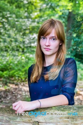 Portrait Of Dutch Redhead Teenage Girl In Forest Stock Photo