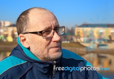 Portrait Of Elderly Man Wearing Glasses Stock Photo